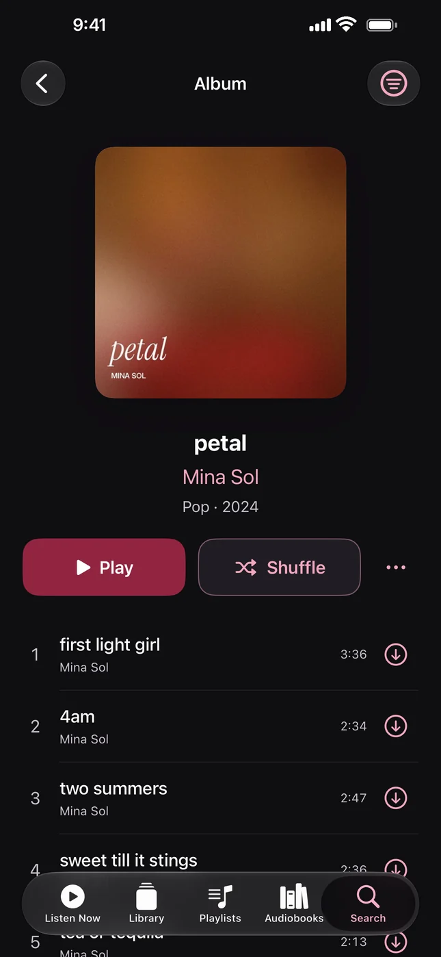 An album page with Play, Shuffle and the track list
